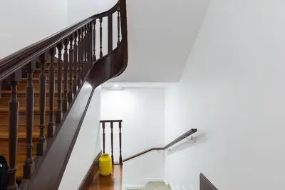 a staircase with a yellow vacuum cleaner next to it at OPO Santa Catarina in Porto