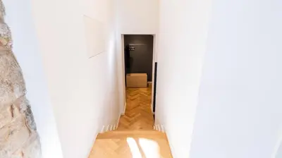 a hallway with white walls and a black door at Premium Duplex in Bonfim by LovelyStay in Porto