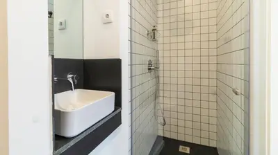 a bathroom with a white sink and a mirror at Premium Duplex in Bonfim by LovelyStay in Porto