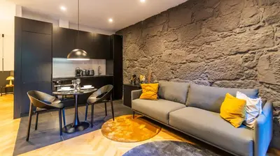 a living room with a couch and a table at Luxury Oasis in Bonfim by LovelyStay in Porto