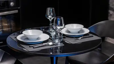 a black table with glasses and bowls and plates on it at Luxury Oasis in Bonfim by LovelyStay in Porto