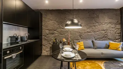 a living room with a couch and a table at Luxury Oasis in Bonfim by LovelyStay in Porto