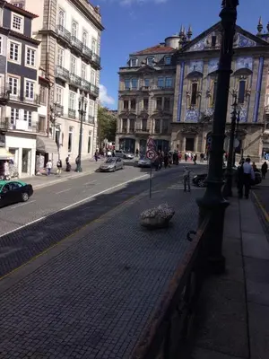 a city street with buildings and a lamp post at Porto Chique AL 2 in Porto