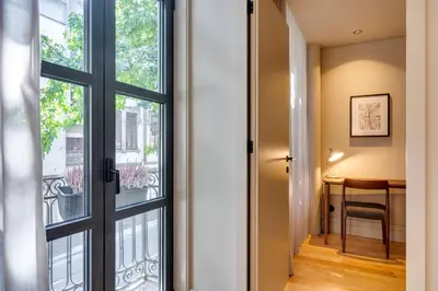 a hallway with a door leading to a balcony at AVUS M Suites and Apartments by DA'HOME in Porto