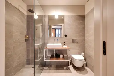 a bathroom with a sink and a toilet at AVUS M Suites and Apartments by DA'HOME in Porto