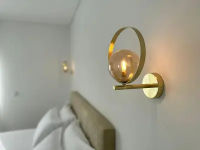 a mirror attached to a wall next to a bed at Marinho's Oporto Apartments in Porto