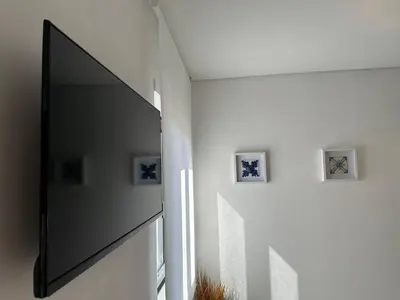 a hallway with a large mirror on a wall at Marinho's Oporto Apartments in Porto