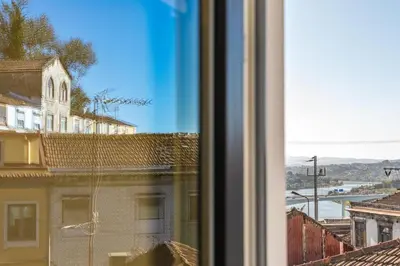 a view of a city from a window at Cozy Studio-Fast Wi-Fi-Near Campanhã Station & River in Porto