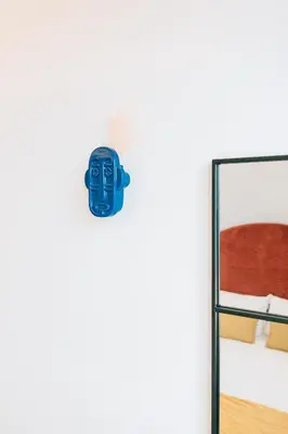a sticker of a mask on the door of a bedroom at ORM Padrão Apartment in Porto