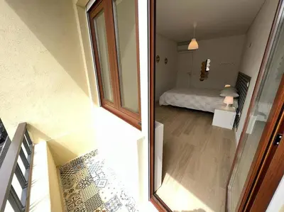 a view of a room with a bed and a window at HEART OF THE CITY 10 ! in Porto