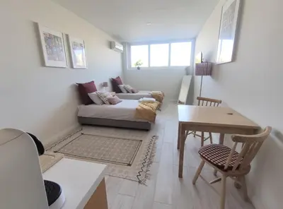a living room with a couch and a table at Leote House - Studio 1 in Porto