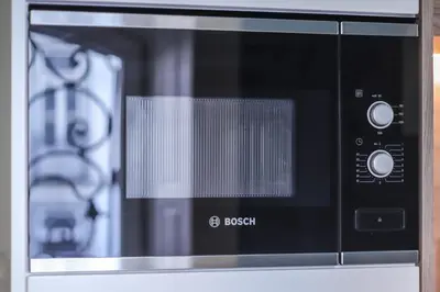 a microwave oven sitting on top of a counter at HM - Infante Riverside Apartment C in Porto