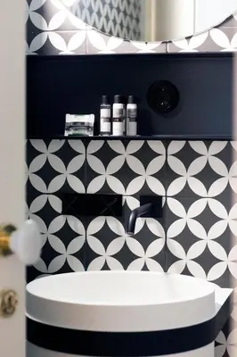 a bathroom with a sink and a black and white wall at HM - Infante Riverside Apartment C in Porto