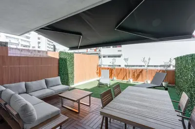 a living room with a couch and a table at Patio in Central Porto in Porto