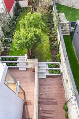 an overhead view of a garden with a wooden walkway at Fontainhas Royal in Porto