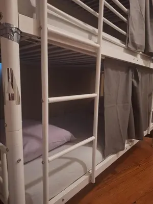 a white bunk bed with the bottom bunkitures at Easy Host Porto in Porto