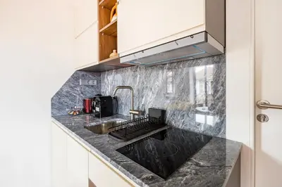 a kitchen with a counter top with a sink at GuestReady - Caldeireiros Studios in Porto
