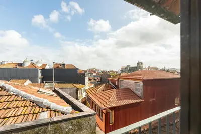 a view of roofs of buildings in a city at GuestReady - Caldeireiros Studios in Porto