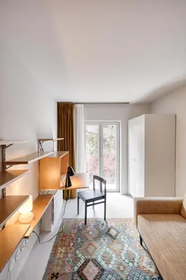 a living room with a couch and a table at L'Olivier 23 - 2 apartments in a recently renovated Guesthouse in Porto