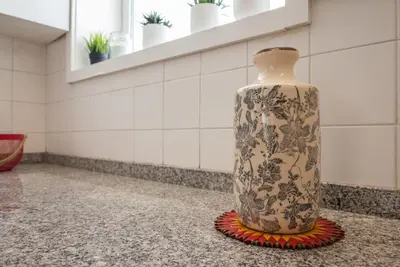a vase sitting on the floor in a room at Gardeny Porto in Porto