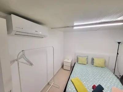 a kitchen with wooden cabinets and a sink at Bela Houses - Porto Center Garden - 3 in Porto