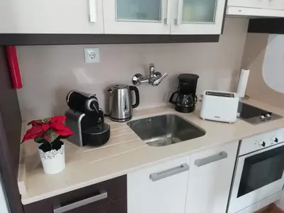 a kitchen counter with a sink and a mixer at Apartment in the historic center of Porto in Porto