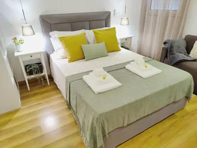 a bedroom with a bed with two trays on it at Apartment in the historic center of Porto in Porto