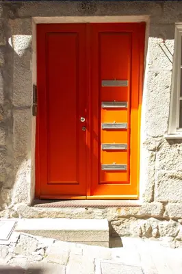 a red door on the side of a building at ORM Santana Apartment in Porto
