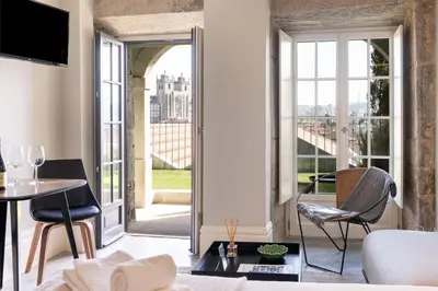 a living room with a view of a building at Panoramic Historic Views Private Terrace - Apt A in Porto