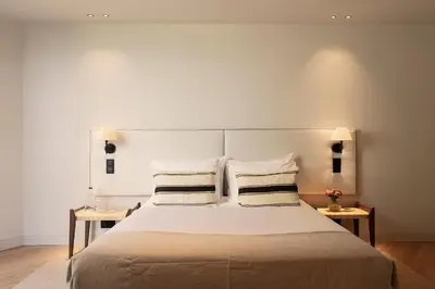 a living room with a long couch and a skylight at Vandoma Serviced Apartments in Porto