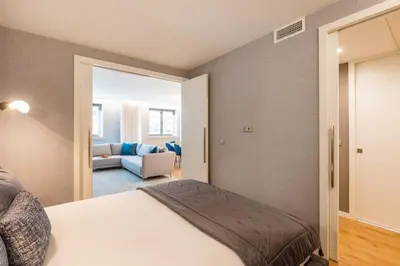a hallway with a door leading to a room at Renovato Deluxe Apartment in Porto
