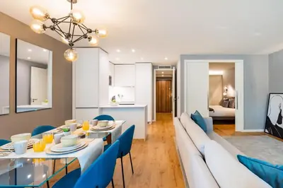 a living room with a couch and a table at Renovato Deluxe Apartment in Porto