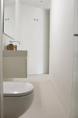 a white bathroom with a toilet and a sink at Classy Urban Life Studio Oporto in Porto