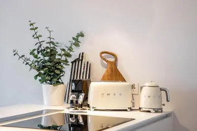 a kitchen counter with two toasters and a toaster at Penthouse with City Views - Almada 551 in Porto