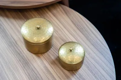 two gold clocks sitting on top of a table at Gaia Retreat by LovelyStay in Vila Nova de Gaia