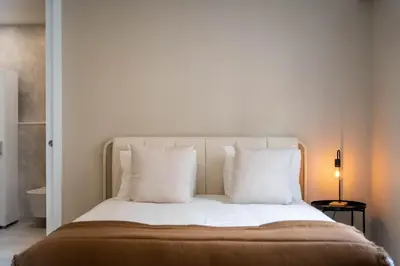 a bedroom with a bed with white pillows at Gaia Retreat by LovelyStay in Vila Nova de Gaia