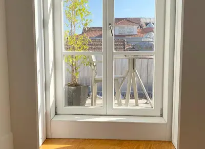 a row of four framed prints on a shelf at Starry Night Balcony in Porto