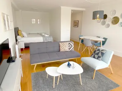a living room with a couch and a table at Starry Night Balcony in Porto