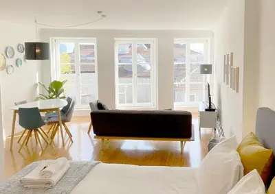 a living room with a couch and a table at Starry Night Balcony in Porto
