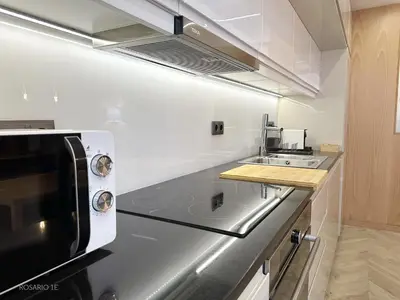 a kitchen with a sink and a microwave at ROSARIO 1E by rosario inn porto in Porto