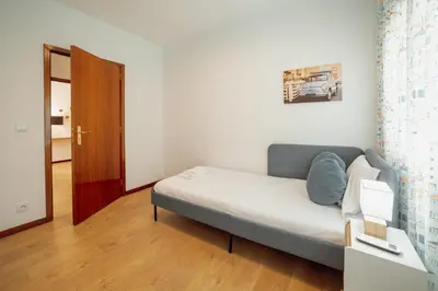 a living room with a couch in a room at City Center Grand Apartment With Seaview Terrace by Vacationy in Porto