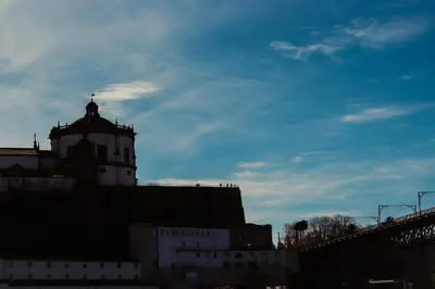 a building with a tower on top of it at Panoramic River View Downtown With Terrace in Porto