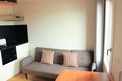 a living room with a couch and a table at Oporto Trendy Apartments in Porto