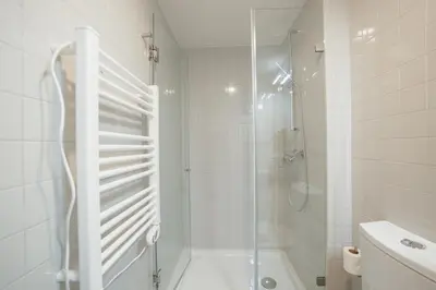 a bathroom with a sink and a mirror at Home With a Pool by Vacationy in Porto