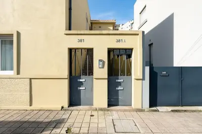 a building with two doors on the side of it at VIVA Bonfim Cozy Home in Porto
