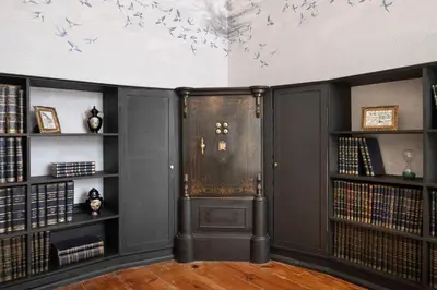 a room with black bookshelves and a door at Cardosas Gem - Historic ap 1F in Porto