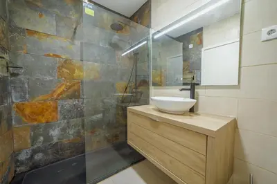 a bathroom with a sink and a shower at Pateo In Lapa City Center by Vacationy in Porto