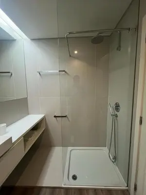 a shower with a glass door in a bathroom at Acquamarina Porto in Porto