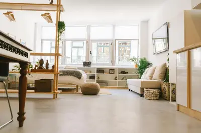 a living room with a couch and a fireplace at Porto Serenity loft. in Porto
