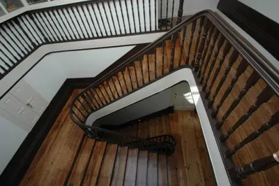 a spiral staircase with a bench in the middle at Hungarian Biscuits Historic Center in Porto